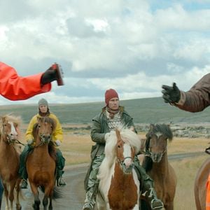 Foto De caballos y hombres